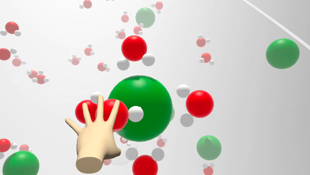 Eine Hand greift nach rot-weißen und grünen Molekülen.